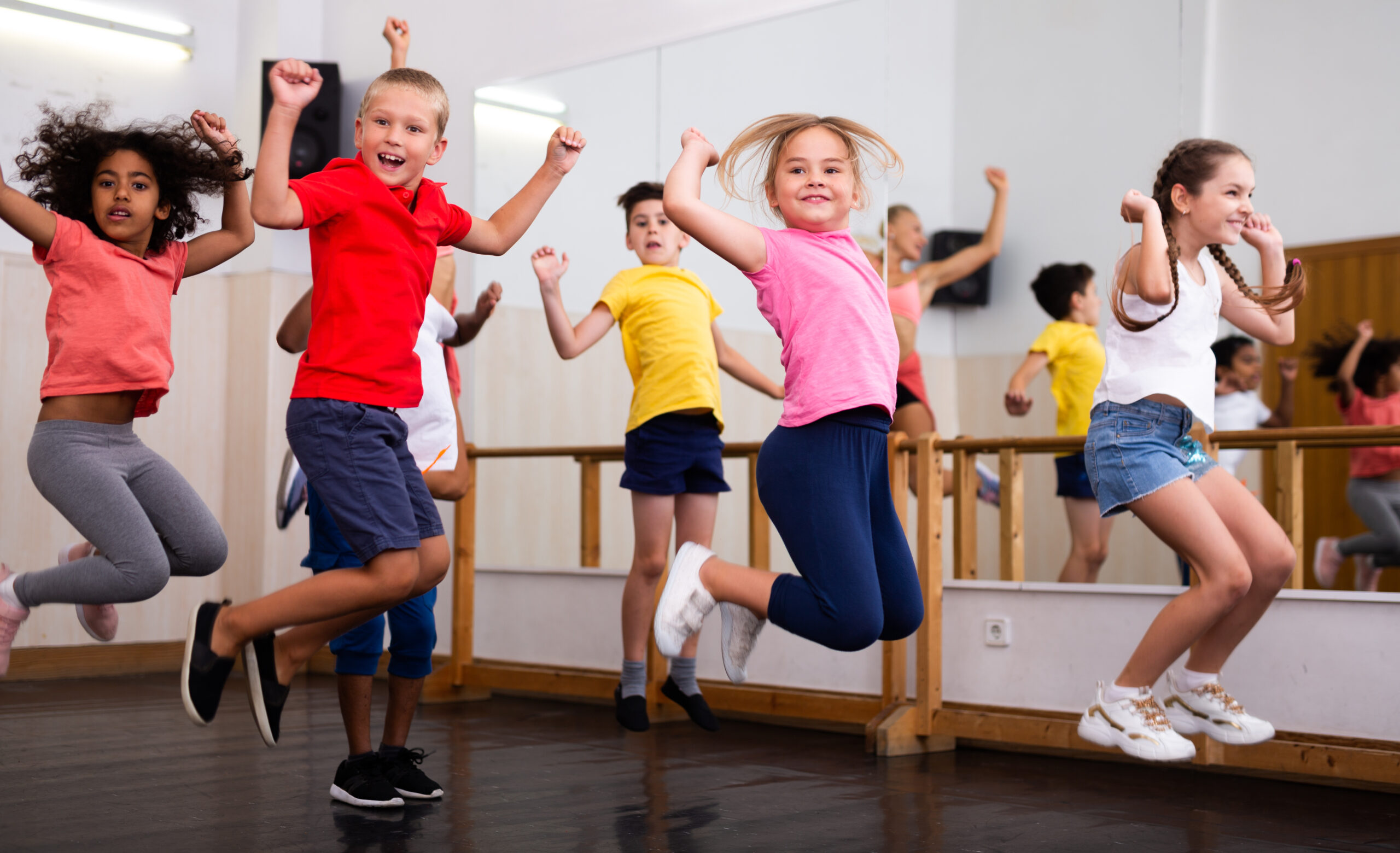 Boys and girls training in dance studio