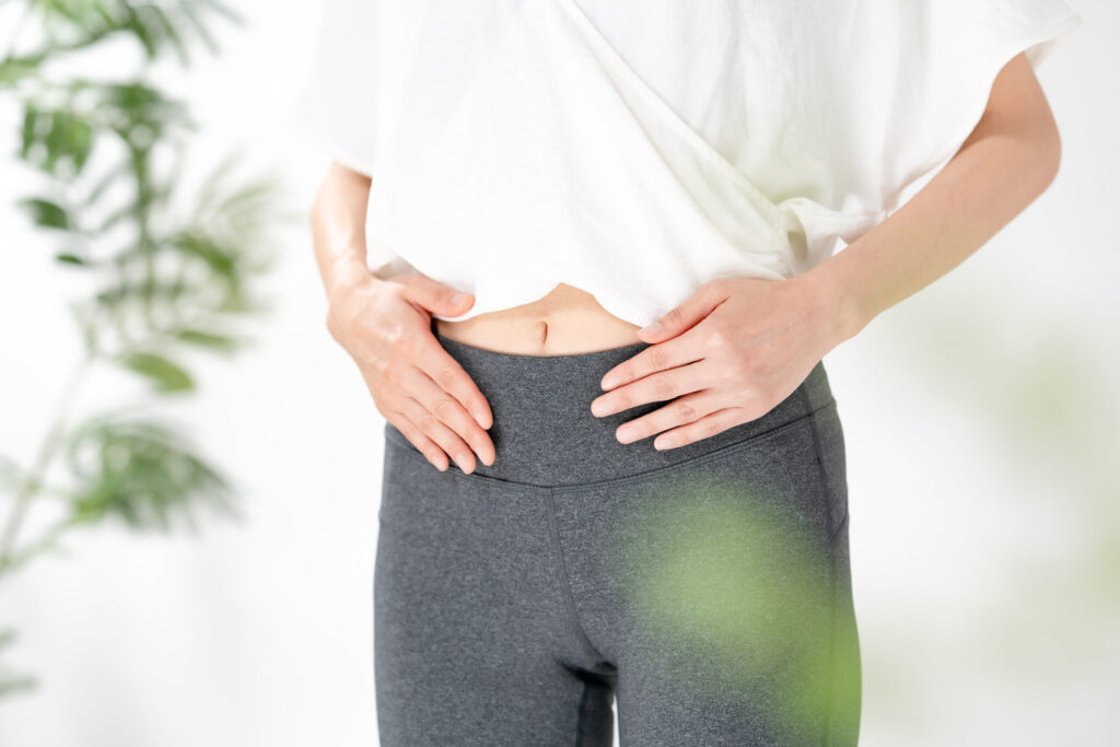 woman touching stomach